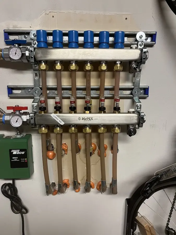 Plumber performing Water Heater Repair at a residential property in Omro